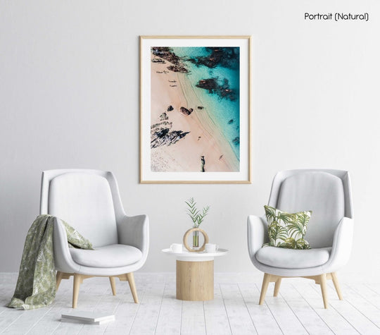 Aerial of kids playing on a beach in Kalk Bay in a natural fine art frame