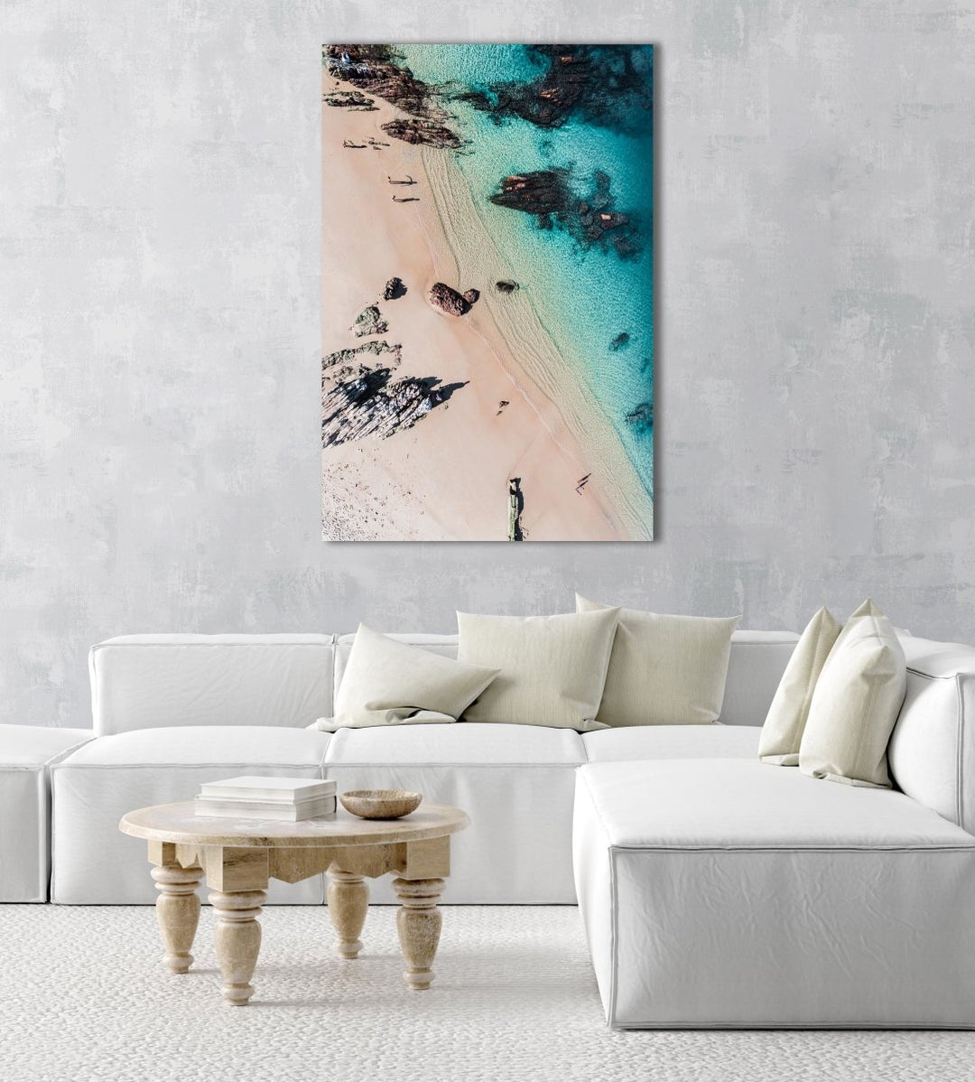 Aerial of kids playing on a beach in Kalk Bay in a natural fine art frame