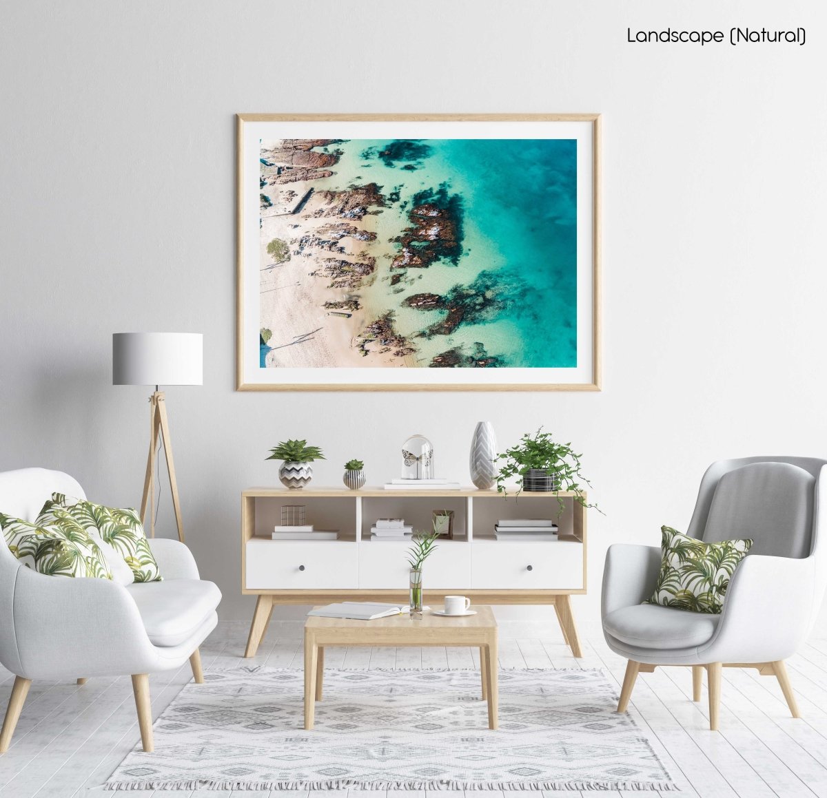 Bright turquoise blue water and rocks along Kalk Bays beach in a natural fine art frame