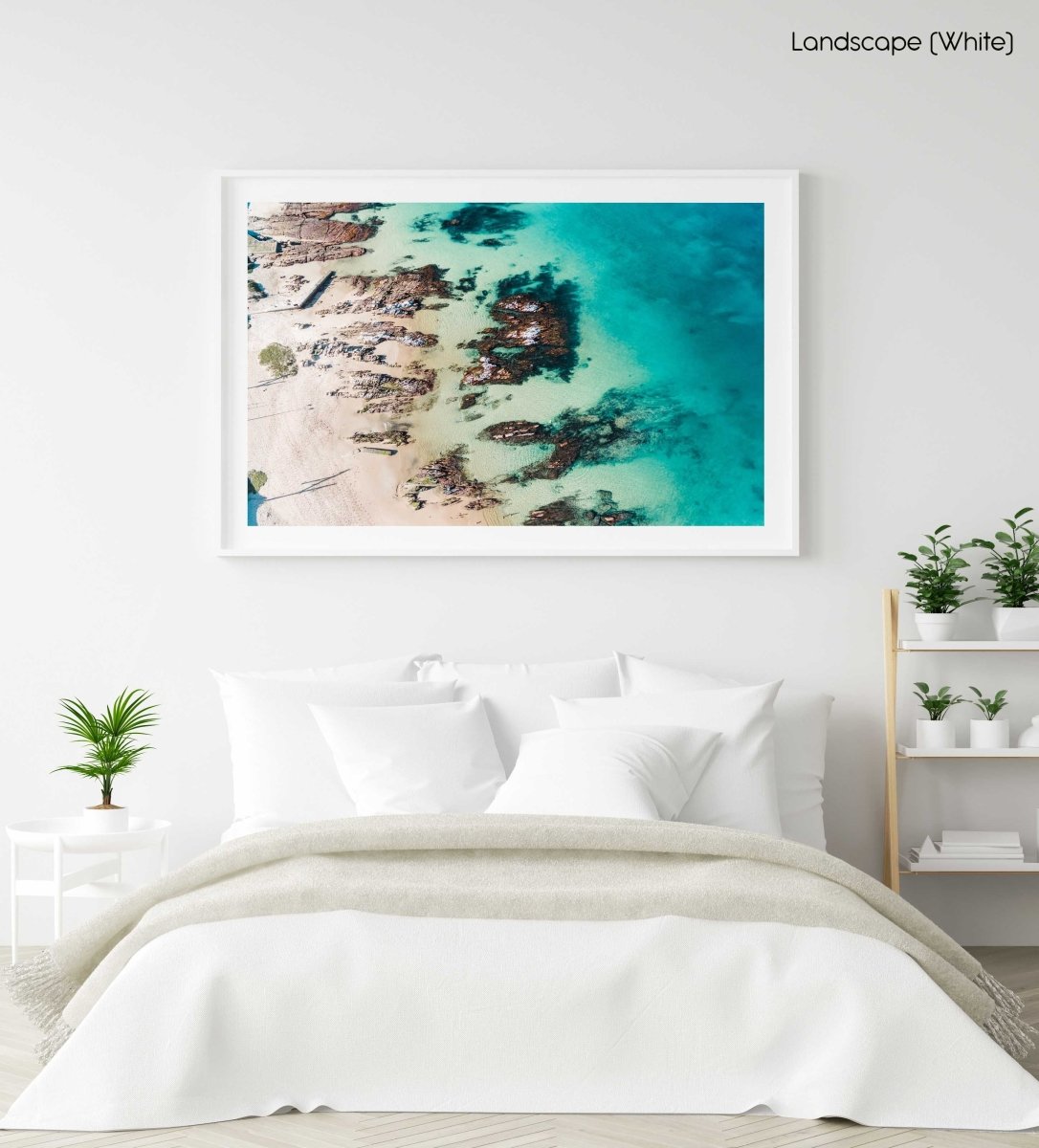 Bright turquoise blue water and rocks along Kalk Bays beach in a white fine art frame