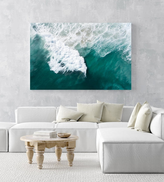 Large wave crashing at Noordhoek beach seen from above in a white fine art frame