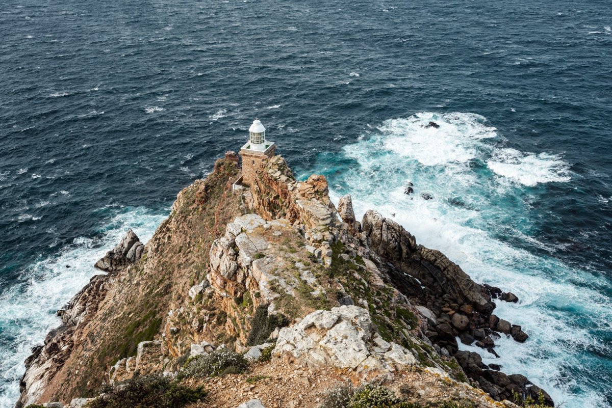 Lighthouse at Cape Point with windy ocean