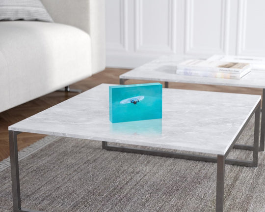 Aerial of girl holding striped surfboard in blue water in Camps Bay Beach in a white fine art frame