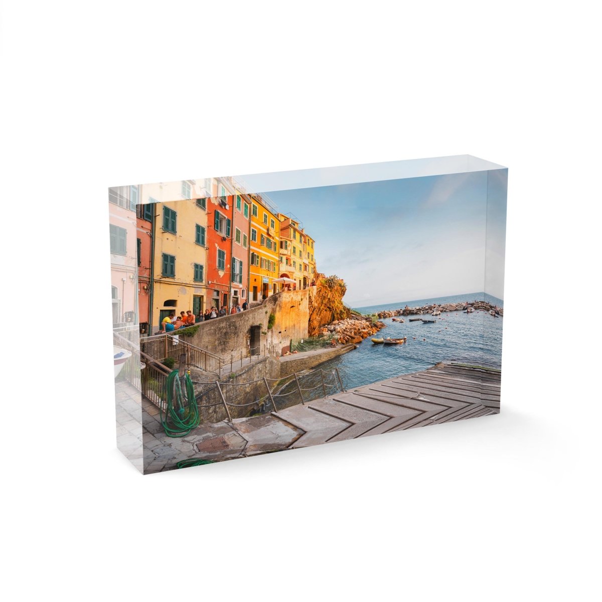 Slipway and people walking along ocean in Riomaggiore