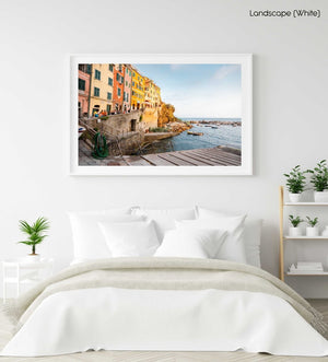 Slipway and people walking along ocean in Riomaggiore in a white fine art frame