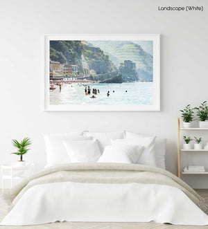 People swimming at castle and hills of Monterosso in Cinque Terre in a white fine art frame