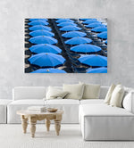Rows of blue umbrellas and chairs on italian beach in an acrylic/perspex frame