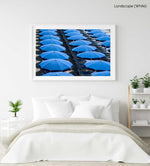 Rows of blue umbrellas and chairs on italian beach in a white fine art frame