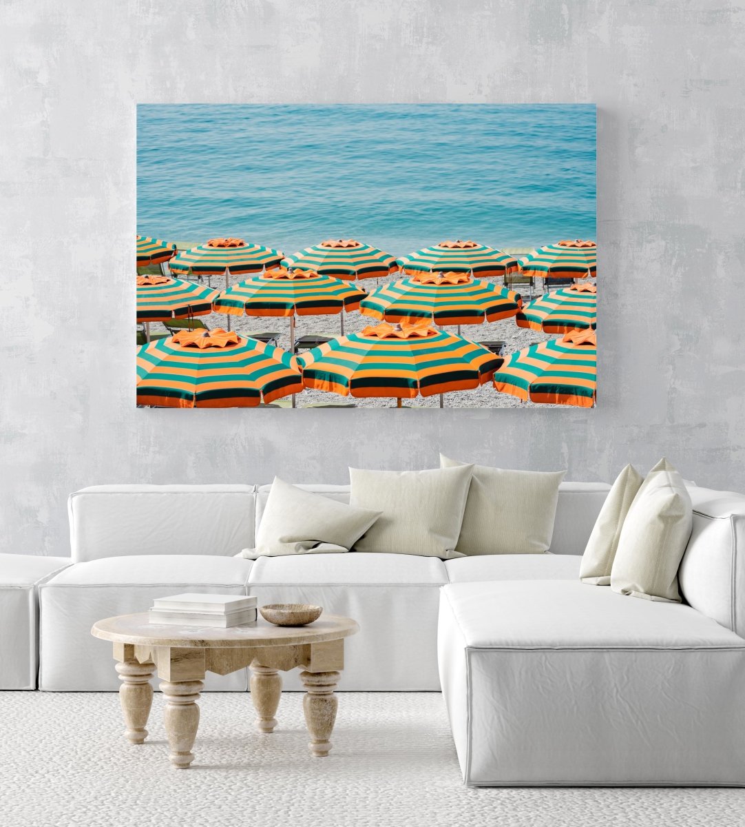 Rows of striped orange umbrellas and turquoise sea in Cinque Terre in an acrylic/perspex frame