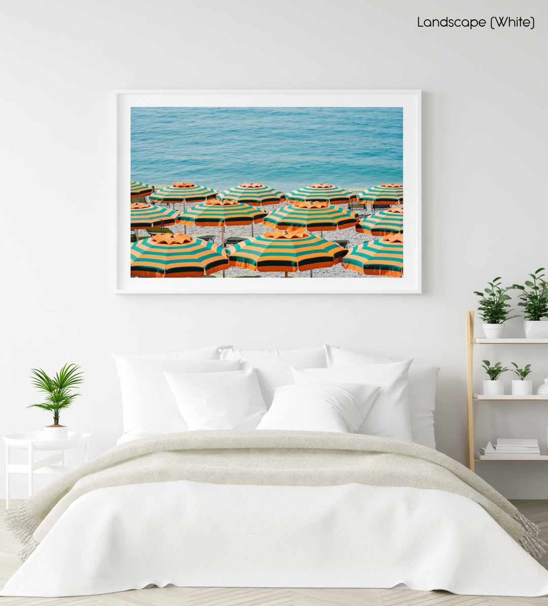 Rows of striped orange umbrellas and turquoise sea in Cinque Terre in a white fine art frame