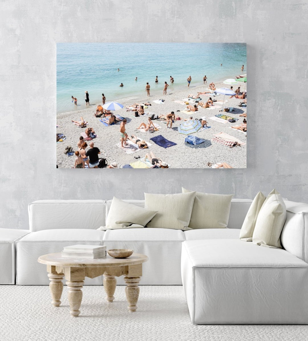 Beach goers lying on sand at italian beach in an acrylic/perspex frame