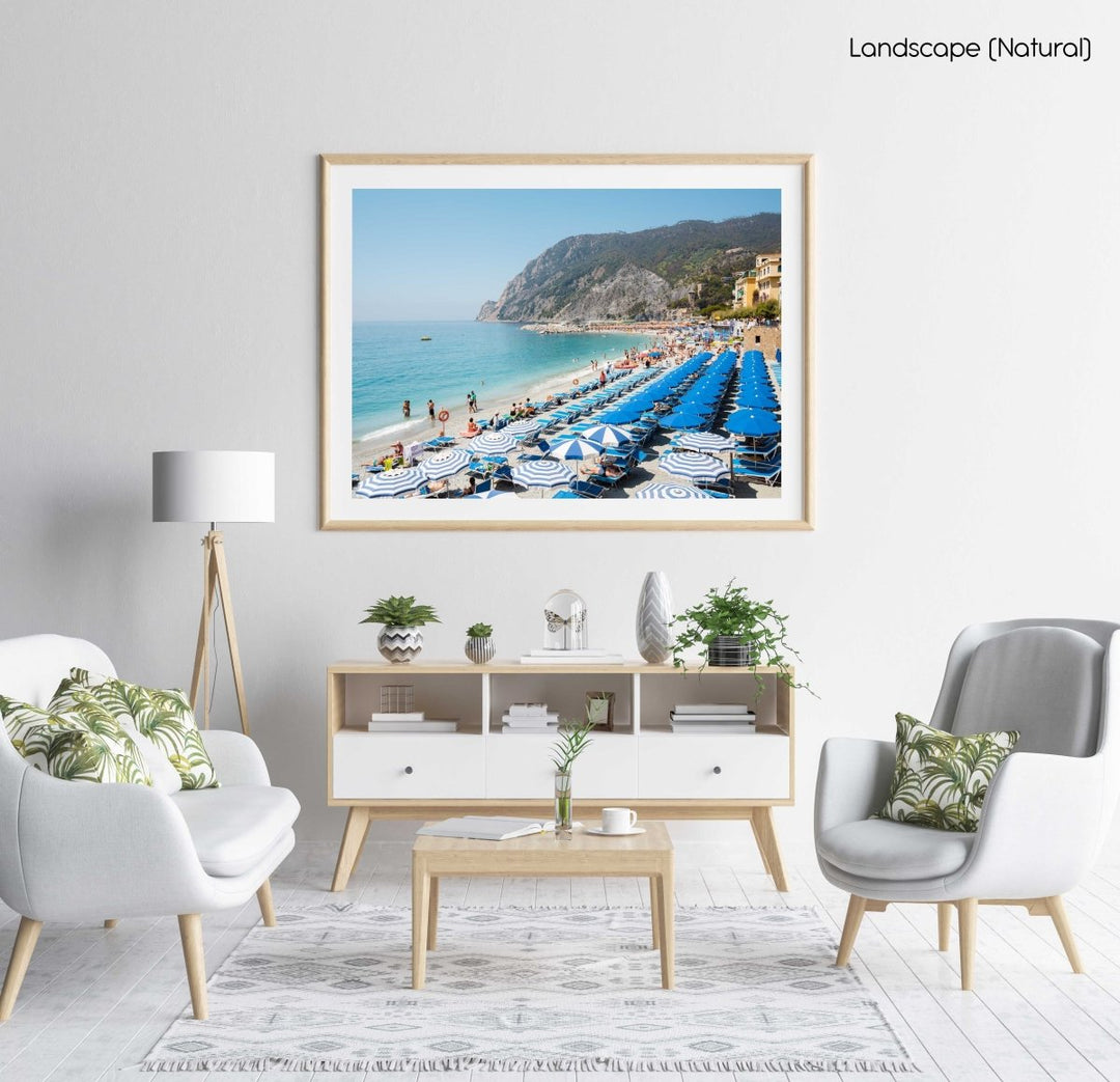 People and umbrellas at Monterosso beach Cinque Terre during summer in a natural fine art frame