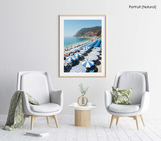 People and umbrellas at Monterosso beach Cinque Terre during June in a natural fine art frame