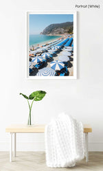 People and umbrellas at Monterosso beach Cinque Terre during June in a white fine art frame