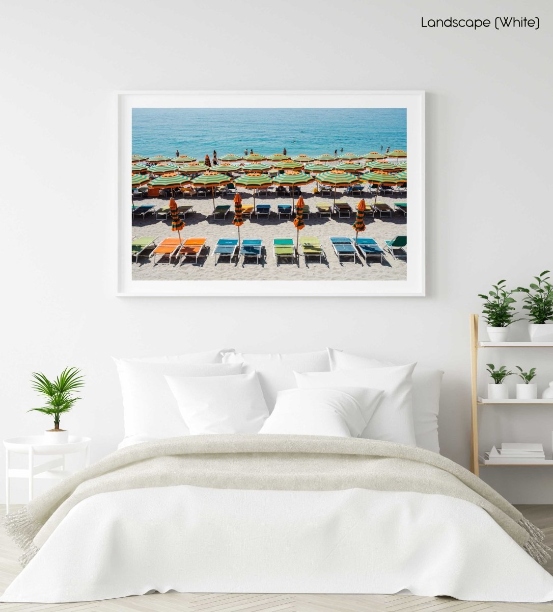 Orange, green and blue colors of umbrellas and sea in Cinque Terre in a white fine art frame