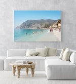 Hot sunny day with people swimming at Monterosso beach Italy in an acrylic/perspex frame