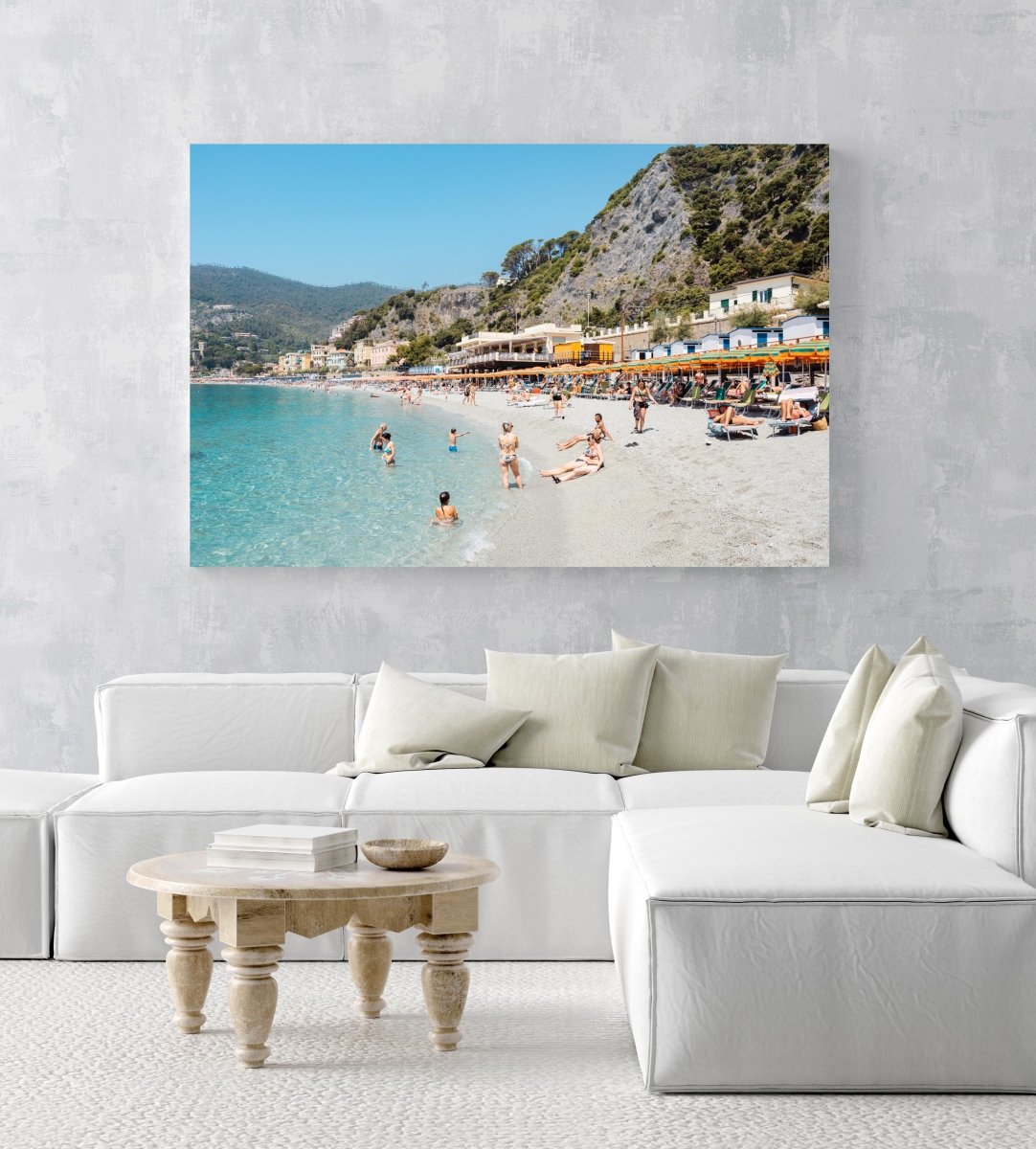 People swimming and sitting at colorful Monterosso beach in Cinque Terre in an acrylic/perspex frame