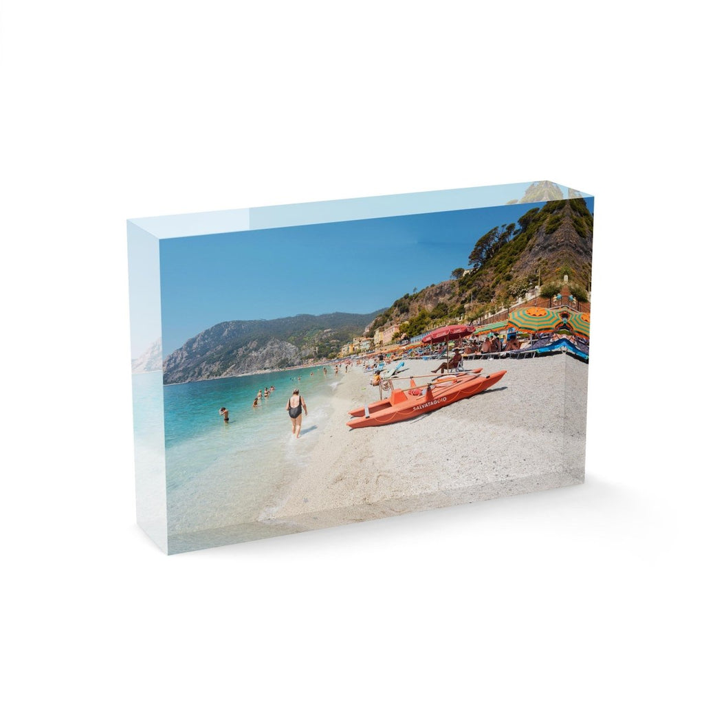 Italian vibes along Monterosso beach with people swimming and lying at water