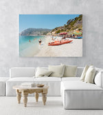 Italian vibes along Monterosso beach with people swimming and lying at water in an acrylic/perspex frame