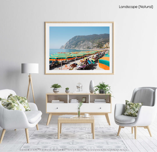 Orange umbrellas and people tanning on Monterosso Beach Cinque Terre in a natural fine art frame