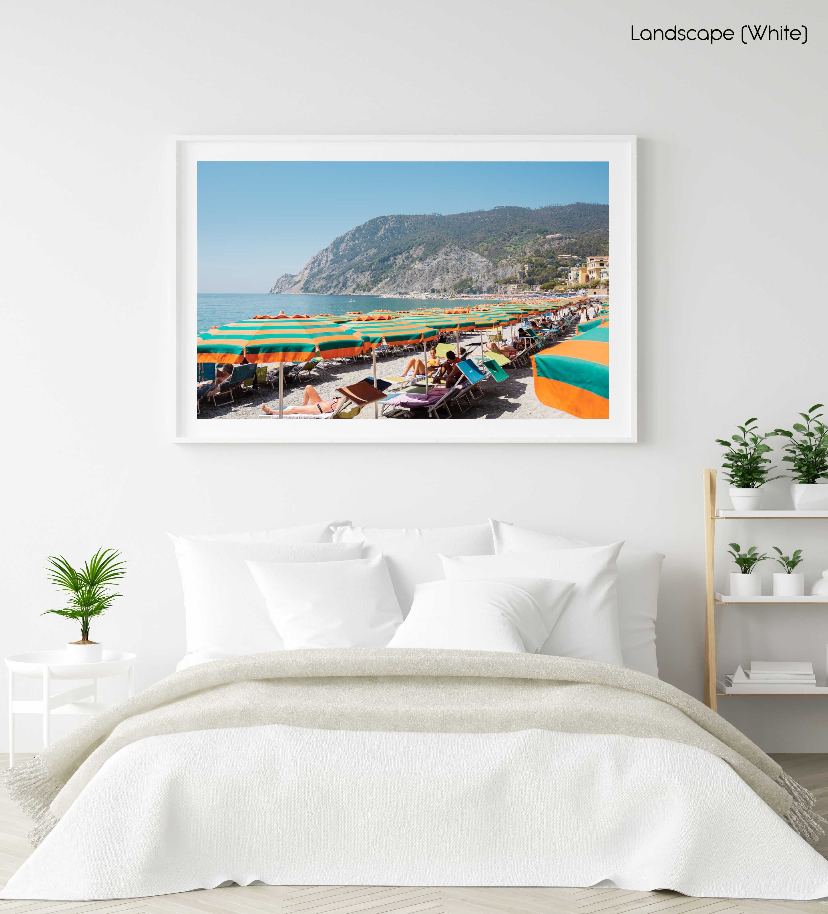Orange umbrellas and people tanning on Monterosso Beach Cinque Terre in a white fine art frame