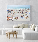 People lying on Monterosso beach with pebbles in Cinque Terre in an acrylic/perspex frame