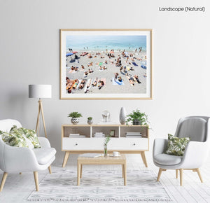 People lying on Monterosso beach with pebbles in Cinque Terre in a natural fine art frame