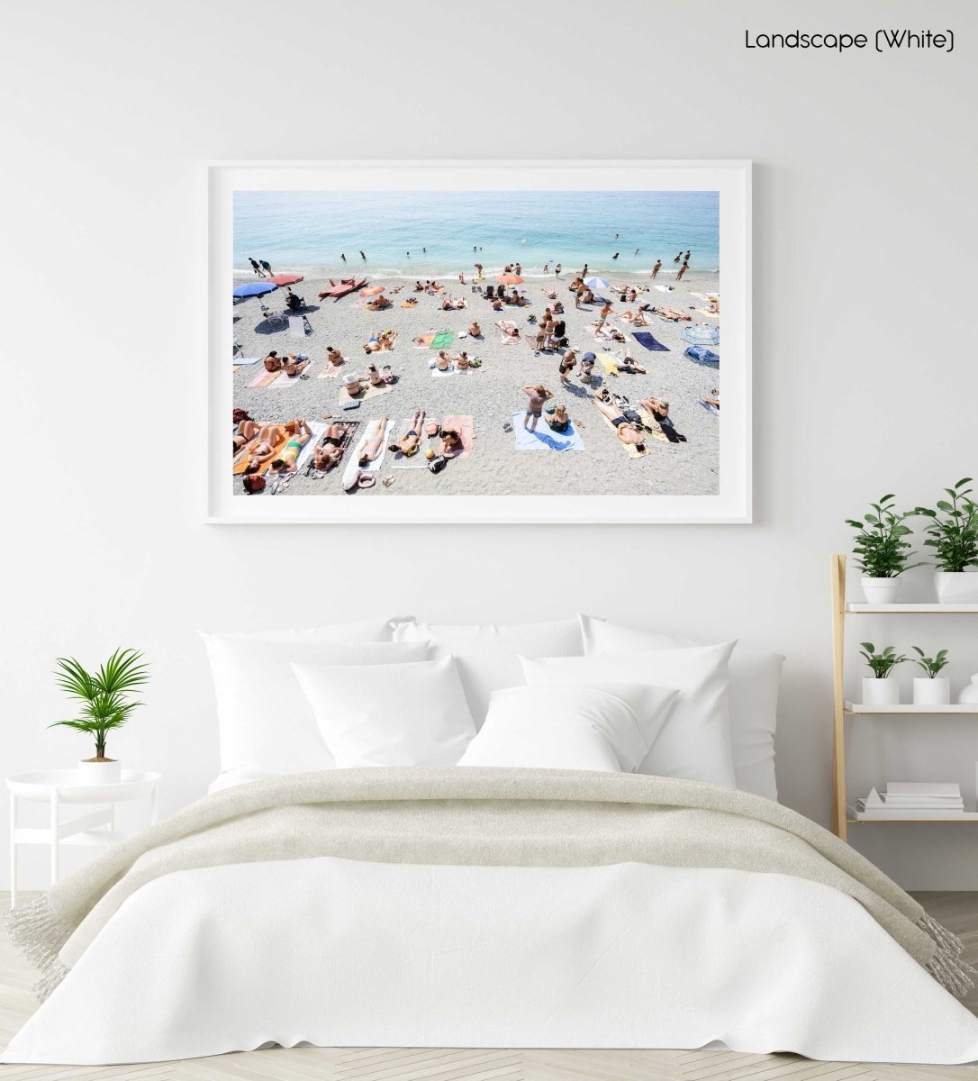 People lying on Monterosso beach with pebbles in Cinque Terre in a white fine art frame