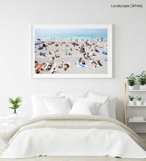 People lying on Monterosso beach with pebbles in Cinque Terre in a white fine art frame