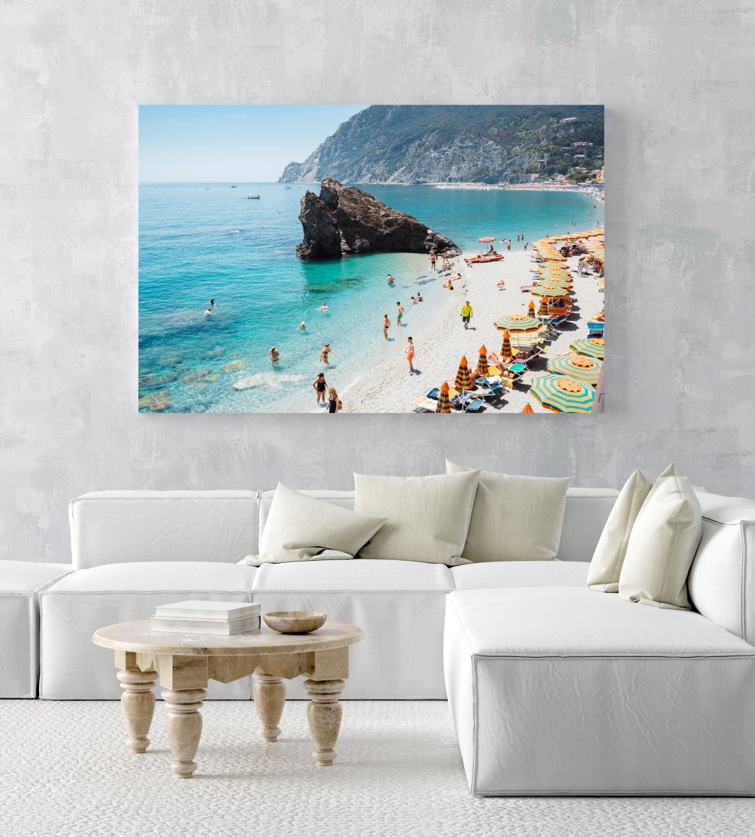 Big rock on Monterosso beach surrounded by people and blue water Cinque Terre in an acrylic/perspex frame