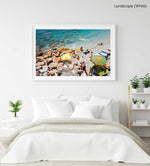 Umbrellas and people on beach with rocks and sand in Cinque Terre in a white fine art frame
