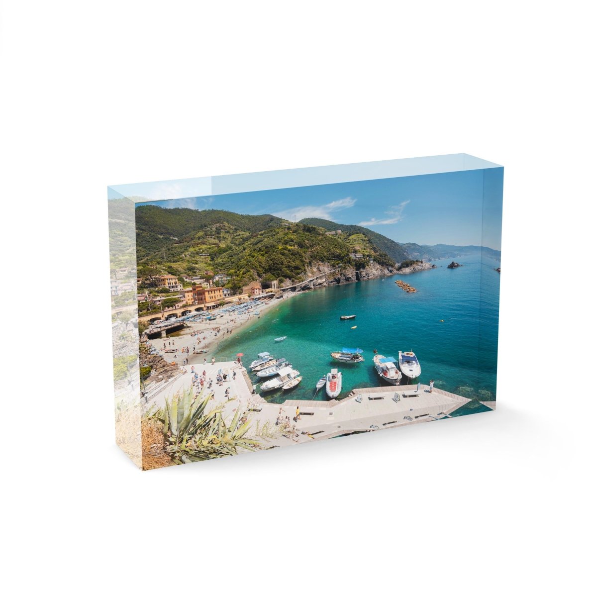 Boats docked along promenade of old town Monterosso during summer in Cinque Terre