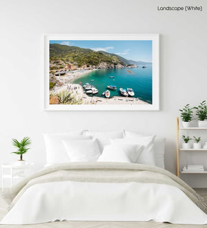 Boats docked along promenade of old town Monterosso during summer in Cinque Terre in a white fine art frame