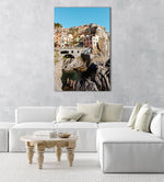 People swimming amongst bridge and colorful buildings of Manarola in Cinque Terre in an acrylic/perspex frame