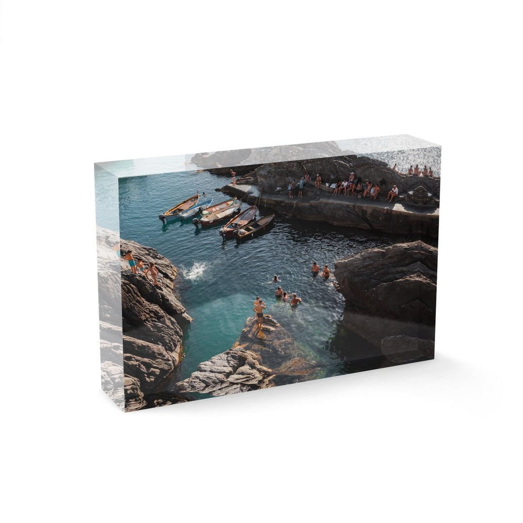 People jumping off rocks at Manarola in Cinque Terre