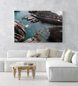 People jumping off rocks at Manarola in Cinque Terre in an acrylic/perspex frame