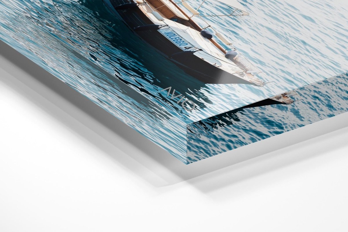 Man driving a rental boat along Cinque Terre coastline in an acrylic/perspex frame