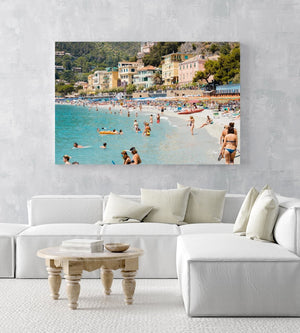 Busy Monterosso beach with people swimming, snorkeling and chilling on summers day in an acrylic/perspex frame