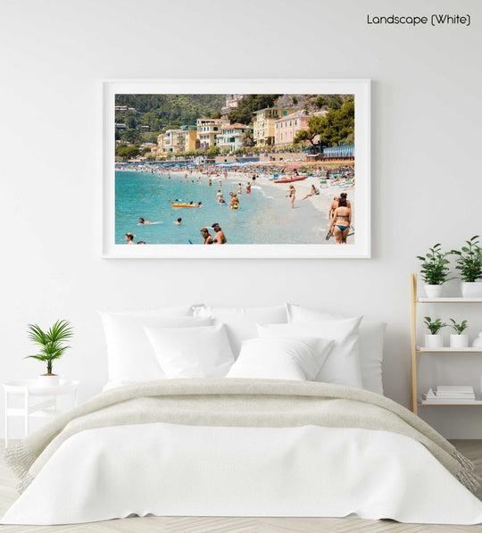 Busy Monterosso beach with people swimming, snorkeling and chilling on summers day in a white fine art frame