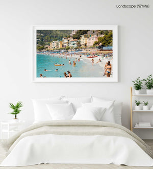 Busy Monterosso beach with people swimming, snorkeling and chilling on summers day in a white fine art frame