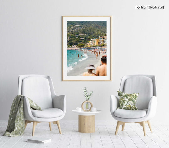 People walking and swimming in blue water of Monterosso beach in Cinque Terre in a natural fine art frame