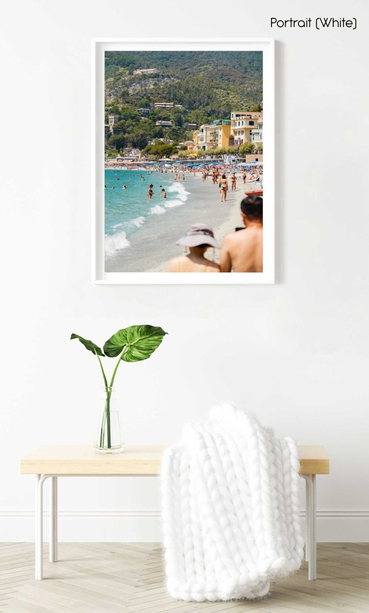 People walking and swimming in blue water of Monterosso beach in Cinque Terre in a white fine art frame