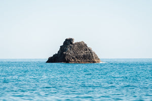 Big rock in middle of blue ocean Cinque Terre