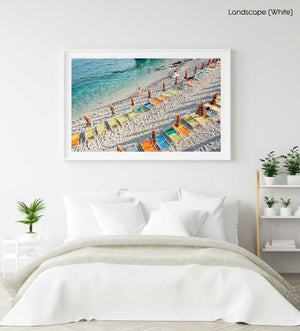 Orange, green and blue chairs on beach in Cinque Terre in a white fine art frame