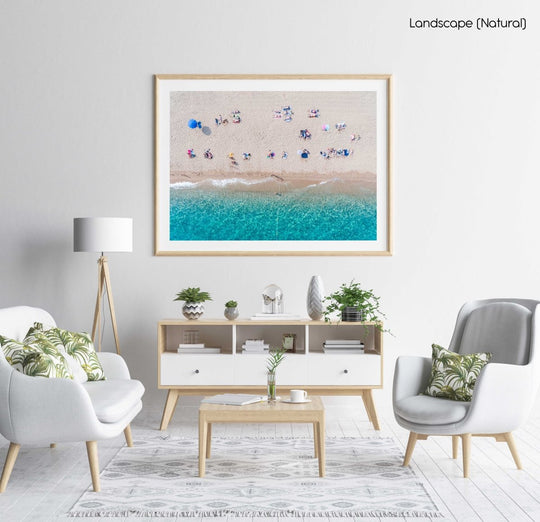 Lines of people tanning on beach in Spain from aerial view in a natural fine art frame