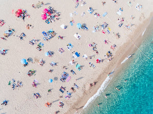Aerial of people lying in the sun on the beach