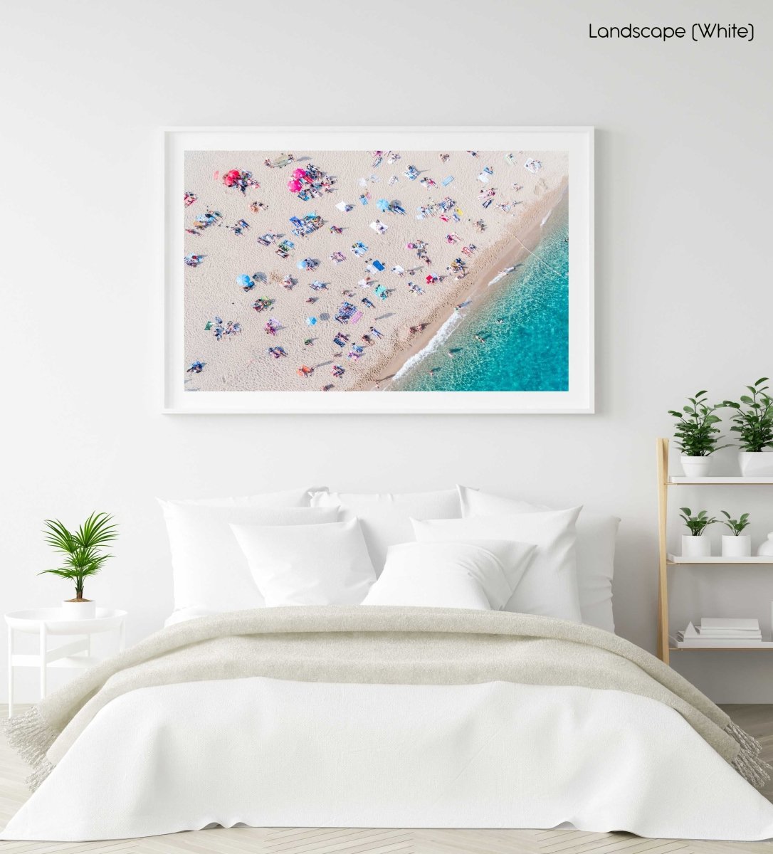 Aerial of people lying in the sun on the beach in a white fine art frame