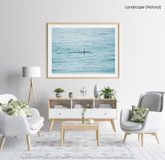 Woman swimming backstroke in the ocean in Costa Brava in a natural fine art frame