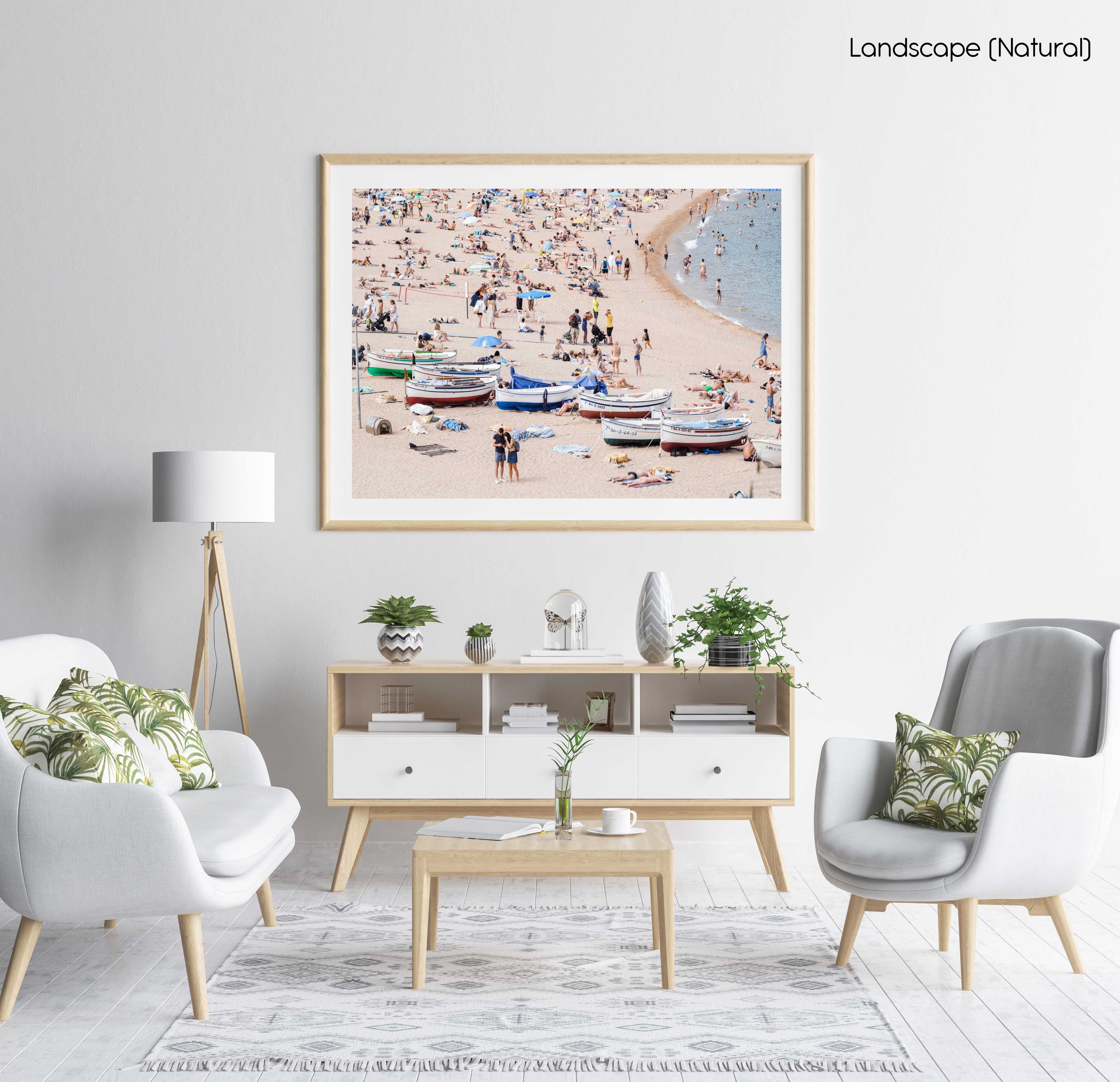 Boats and people beached along Tossa de Mar beach in a natural fine art frame