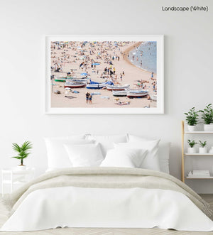 Boats and people beached along Tossa de Mar beach in a white fine art frame